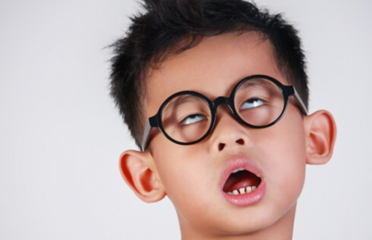 A student Wearing Glasses Getting Bored During IELTS Test Preparation